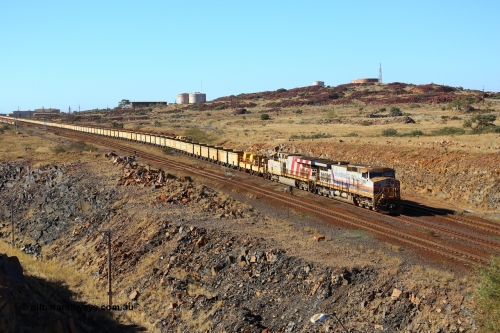 170729 0322
Parker Point, an empty train is worked back towards Seven Mile yard along the Empty Car Line behind General Electric built Dash 9-44CW unit 7069 serial 47748 in the original Hamersley Iron livery from 1994 and ES44DCi unit 8195. 29th July 2017. [url=https://goo.gl/maps/26rFPJ7MdWK2]GeoData[/url].
Keywords: 7069;GE;Dash-9-44CW;47748;