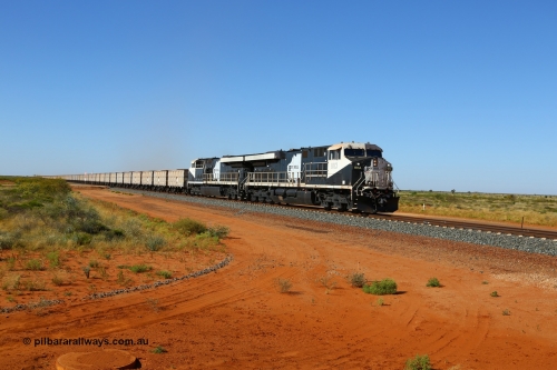 170730 0470
Boodarie, a loaded Roy Hill train approaches the Great Northern Highway grade crossing behind General Electric built ES44ACi units RHA 1013 serial 62585 and sister unit RHA 1014, the third and mid-train unit can be made out at the end of the rack as it curves. 30th July 2017. [url=https://goo.gl/maps/1vWtRDuDjn22]GeoData[/url].
Keywords: RHA-class;RHA1013;GE;ES44ACi;62585;