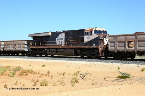 170730 0518
Indee, a loaded Roy Hill train runs along at the 71 km heading to the port with mid-train remote unit General Electric built ES44ACi unit RHA 1021 serial 64302 sandwiched within 224 waggons. 30th July 2017. [url=https://goo.gl/maps/4pcTwmi7BmF2]GeoData[/url].
Keywords: RHA-class;RHA1021;GE;ES44ACi;64302;