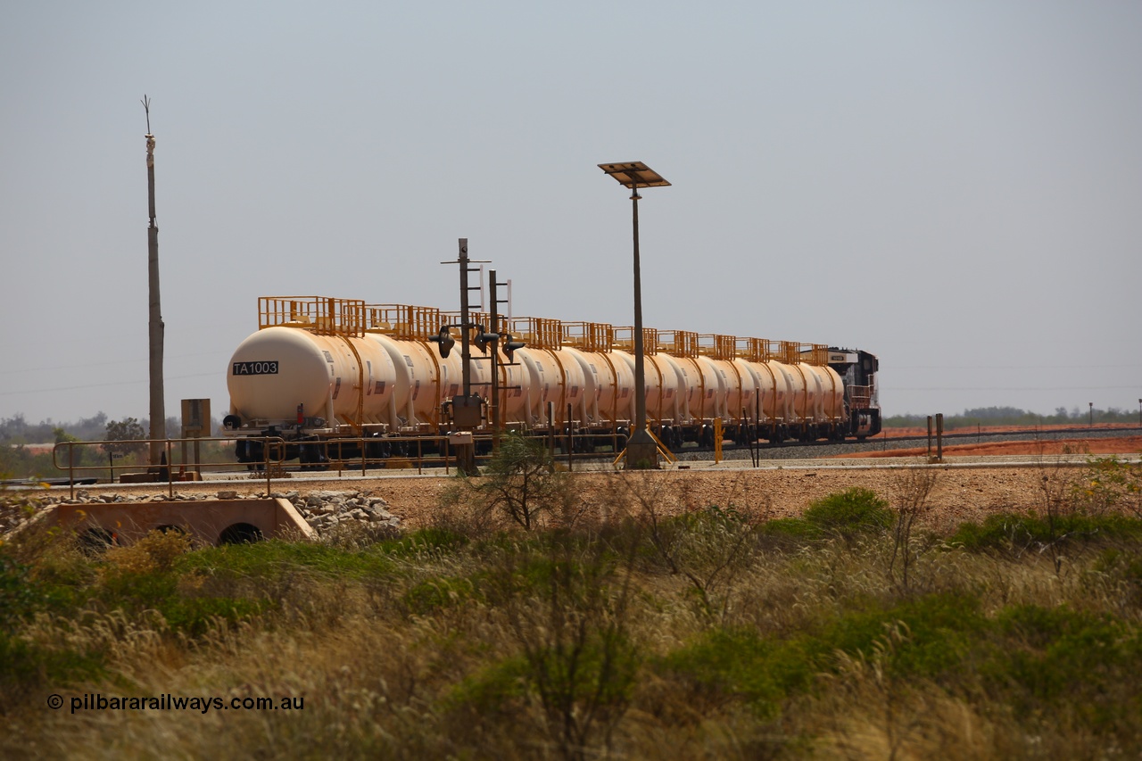 170915 0724
Great Northern Highway 18.2 km grade crossing, empty Roy Hill fuel train powers away north from the highway towards Tad Yard with General Electric built ES44ACi unit RHA 1019 leading eleven of Roy Hill's twelve tank waggons. 15th September 2017. [url=https://goo.gl/maps/DR61N4rDVZy]View map here[/url].
