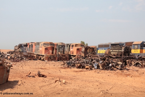 141027 5825
Wedgefield, view out the back of Sell and Parker's metal recycling yard shows a sorry sight. From left is the frame of an SD40R and prime mover, AC6000 6073, SD40R 3091, AC6000 6075 and SD40 3079. Beside 3079 is the remains of AC6000 unit 6071 having been reduced from one of the most powerful locomotives to work in Australia to a munched up tangled mass of metal, the EVO motor is still in the frame.
Keywords: EMD McCook / SD40 | GE;AC6000CW;