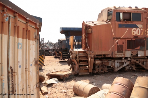 141027 5849
Wedgefield, Sell and Parker's metal recycling yard, General Electric AC6000 units lined up awaiting the chop, 6076 serial 51068, then the rear of 6077 and the nose of 6074.
Keywords: 6076;GE;AC6000CW;51068;