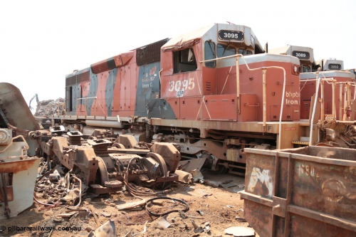 141027 5852
Wedgefield, Sell and Parker's metal recycling yard, view of EMD SD40R unit 3095 serial 33677/7083-7 watching a former sister unit being reduced to bits, a primer mover 645 EMD engine and fuel tank tipped on its side, pilot and bogie, and the excavator with the hydraulic shears.
Keywords: 3095;EMD;SD40R;33677/7083-7;SD40;SP8485;
