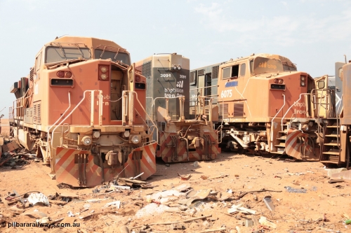 141027 5877
Wedgefield, Sell and Parker's metal recycling yard, General Electric AC6000 units 6073 serial 51065 and 6075 serial 51067 flank EMD SD40R unit 3091 serial 31496/7861-6 prior to scrapping.
Keywords: EMD McCook / SD40 | GE;AC6000CW;