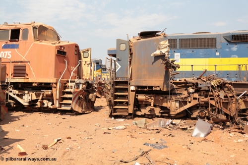 141027 5880
Wedgefield, Sell and Parker's metal recycling yard, General Electric AC6000 units 6075 serial 51067 is nose to nose with the remains of sister unit 6071 serial 51063.
Keywords: GE;AC6000CW;