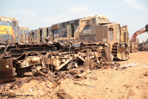 141027 5889
Wedgefield, Sell and Parker's metal recycling yard, view of the trailing bogie and frame of GE AC6000 unit 6071 as sister unit 6972 awaits the same treatment.
Keywords: 6071;GE;AC6000CW;51063;