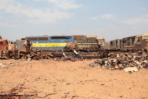 141027 5895
Wedgefield, Sell and Parker's metal recycling yard, General Electric AC6000 unit 6071 serial 51063 is reduced to frame level with only the nose which contains the collision posts and the 6600 hp EVO motor and alternator awaiting the thermal lance.
Keywords: 6071;GE;AC6000CW;51063;