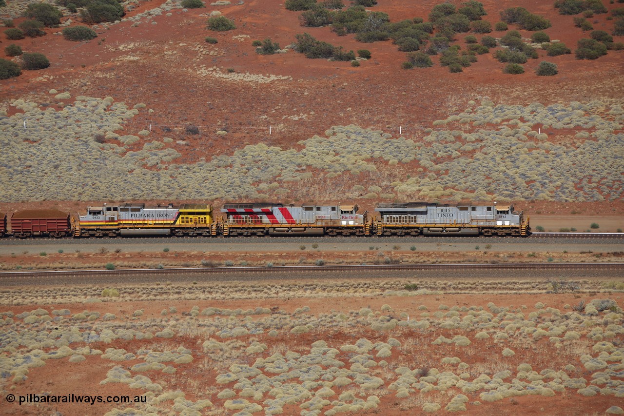 151111 9528
A loaded train behind General Electric ES44DCi units 8113 serial 59105 in the original silver livery and 8145 serial 58726 in the tiger strip Rio livery and Dash 9-44CW 9433 serial 54766 in ROBE Pilbara Iron livery runs along on the West Mainline bound for Cape Lambert viewed from Table Hill.
Keywords: 8113;GE;ES44DCi;59105;