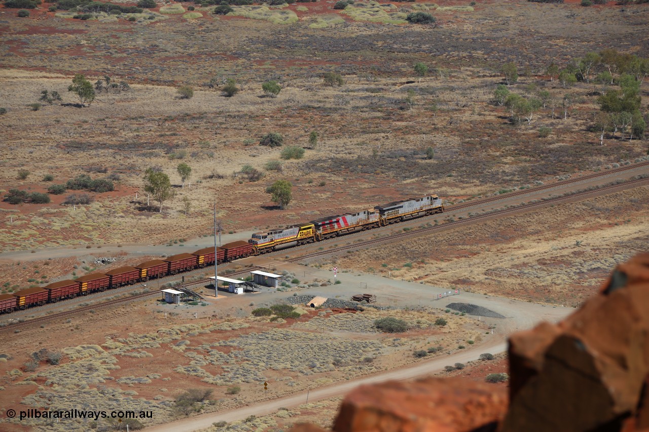 151111 9531
A loaded train behind General Electric ES44DCi units 8113 serial 59105 in the original silver livery and 8145 serial 58726 in the tiger strip Rio livery and Dash 9-44CW 9433 serial 54766 in ROBE Pilbara Iron livery runs along on the West Mainline bound for Cape Lambert viewed from Table Hill.
Keywords: 8113;GE;ES44DCi;59105;