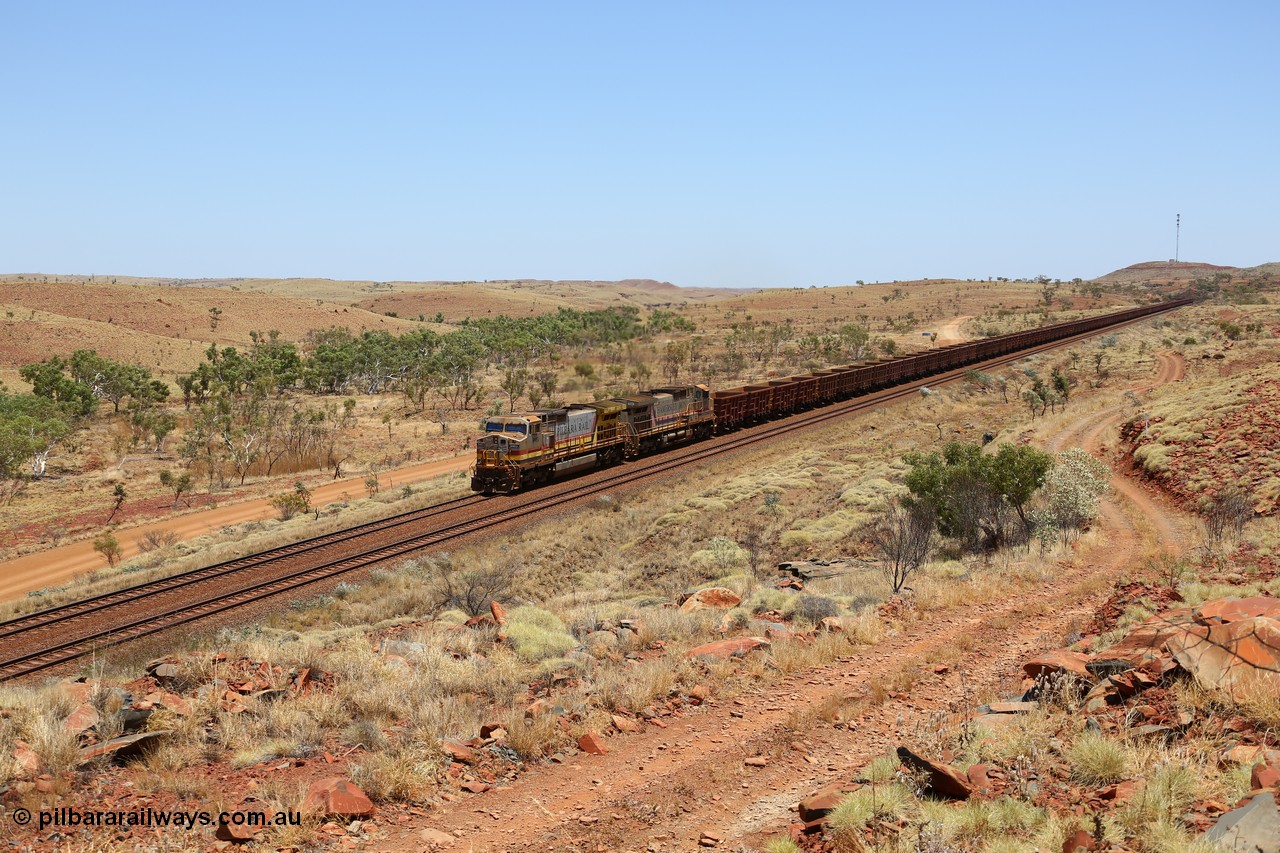 151111 9577
An empty train is still struggling upgrade at the 98 km post on the Tom Price line behind double General Electric Dash 9-44CW units 9403 serial 53457 wearing ROBE Pilbara Rail livery and 7087 serial 47766 wearing the original Hamersley Iron livery.
Keywords: 9403;GE;Dash-9-44CW;53457;