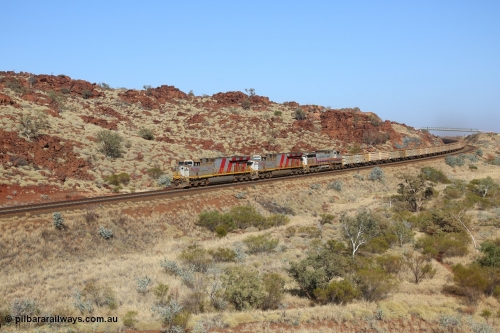 151111 9493
Near the 38 km post, an empty train lead by General Electric ES44DCi units 8160 and 8193 serials 60224 and 61852 and General Electric Dash 9-44CW 7074 serial 47743 power under the water supply pipeline on the Cape Lambert line.
Keywords: 8160;GE;ES44DCi;60224;