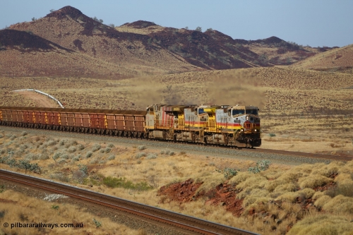 151111 9500
At the 47 km post on the Cape Lambert line a loaded train runs along on the West Mainline behind 7050 and 7057 both General Electric Dash 9-44CW units with serials of 57101 and 55882 and the last General Electric ES44DCi 8199, serial 61858.
Keywords: 7050;GE;Dash-9-44CW;57101;