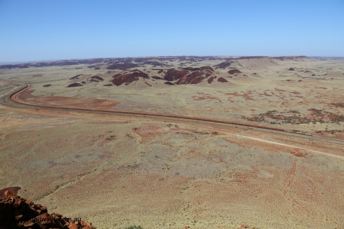 151111 9526
A loaded train behind General Electric ES44DCi units 8113 serial 59105 in the original silver livery and 8145 serial 58726 in the tiger strip Rio livery and Dash 9-44CW 9433 serial 54766 in ROBE Pilbara Iron livery runs along on the West Mainline bound for Cape Lambert viewed from Table Hill.
Keywords: 8113;GE;ES44DCi;59105;