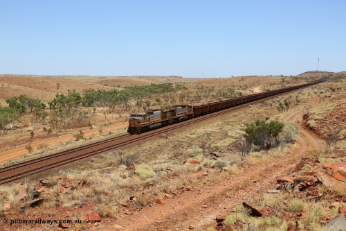 151111 9577
An empty train is still struggling upgrade at the 98 km post on the Tom Price line behind double General Electric Dash 9-44CW units 9403 serial 53457 wearing ROBE Pilbara Rail livery and 7087 serial 47766 wearing the original Hamersley Iron livery.
Keywords: 9403;GE;Dash-9-44CW;53457;