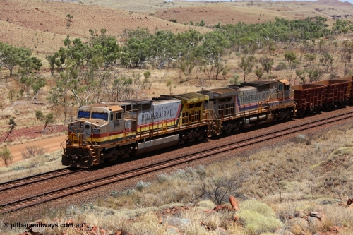 151111 9579
An empty train is still struggling upgrade at the 98 km post on the Tom Price line behind double General Electric Dash 9-44CW units 9403 serial 53457 wearing ROBE Pilbara Rail livery and 7087 serial 47766 wearing the original Hamersley Iron livery.
Keywords: 9403;GE;Dash-9-44CW;53457;