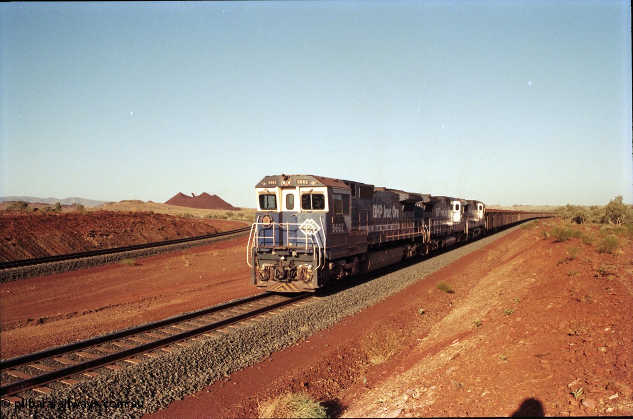 196-15
Yandi Two loaded car side of the loadout balloon loop, loaded train departing behind BHP Iron Ore triple CM40-8M units, 5662 'Port Kembla' serial 8412-07 / 94-153 rebuilt by Goninan in 1994 from Comeng NSW built ALCo M636C #5490 serial C6084-6 from 1974, leading two similar sister units. May 1998.
Keywords: 5662;Goninan;GE;CM40-8M;8412-07/94-153;rebuild;Comeng-NSW;ALCo;M636C;5490;C6084-6;