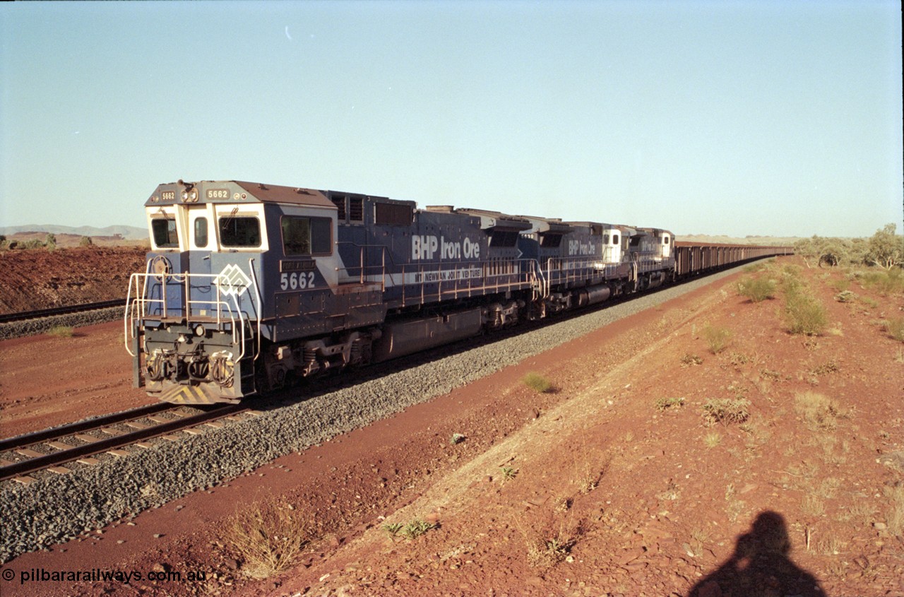196-16
Yandi Two loaded car side of the loadout balloon loop, loaded train departing behind BHP Iron Ore triple CM40-8M units, 5662 'Port Kembla' serial 8412-07 / 94-153 rebuilt by Goninan in 1994 from Comeng NSW built ALCo M636C #5490 serial C6084-6 from 1974, leading two similar sister units. May 1998.
Keywords: 5662;Goninan;GE;CM40-8M;8412-07/94-153;rebuild;Comeng-NSW;ALCo;M636C;5490;C6084-6;