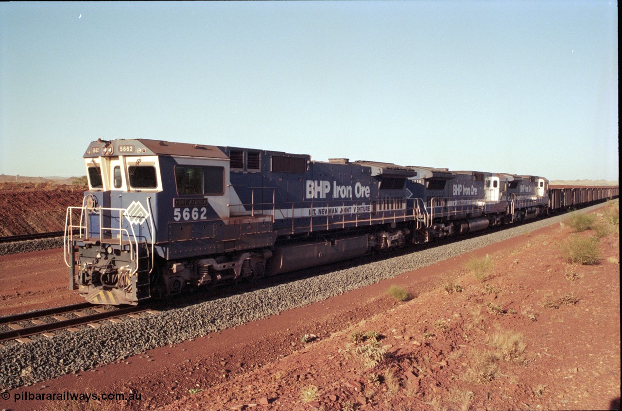 196-17
Yandi Two loaded car side of the loadout balloon loop, loaded train departing behind BHP Iron Ore triple CM40-8M units, 5662 'Port Kembla' serial 8412-07 / 94-153 rebuilt by Goninan in 1994 from Comeng NSW built ALCo M636C number 5490 serial C6084-6 from 1974, leading two similar sister units. May 1998.
Keywords: 5662;Goninan;GE;CM40-8M;8412-07/94-153;rebuild;Comeng-NSW;ALCo;M636C;5490;C6084-6;