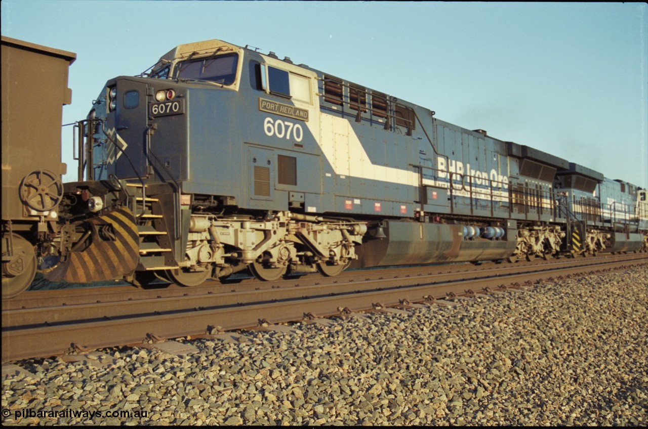 203-07
Bing Siding, BHP General Electric built AC6000 class leader 6070 'Port Hedland' serial 51062 in the passing track as second unit on a Yandi empty working.
Keywords: 6070;GE;AC6000;51062;