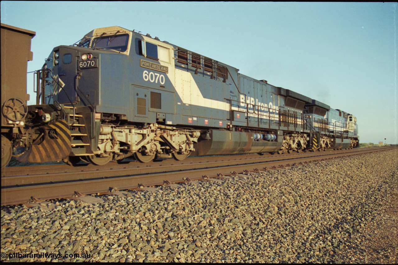 203-08
Bing Siding, BHP General Electric built AC6000 class leader 6070 'Port Hedland' serial 51062 in the passing track as second unit on a Yandi empty working.
Keywords: 6070;GE;AC6000;51062;