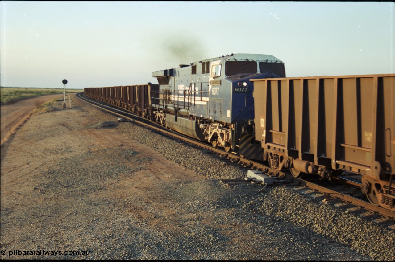 203-24
Bing Siding, min-train unit on an empty Yandi working BHP General Electric built AC6000 6077 'Nimingarra' serial 51069 with the second style of PVC type windscreen protectors fitted.
Keywords: 6077;GE;AC6000;51069;