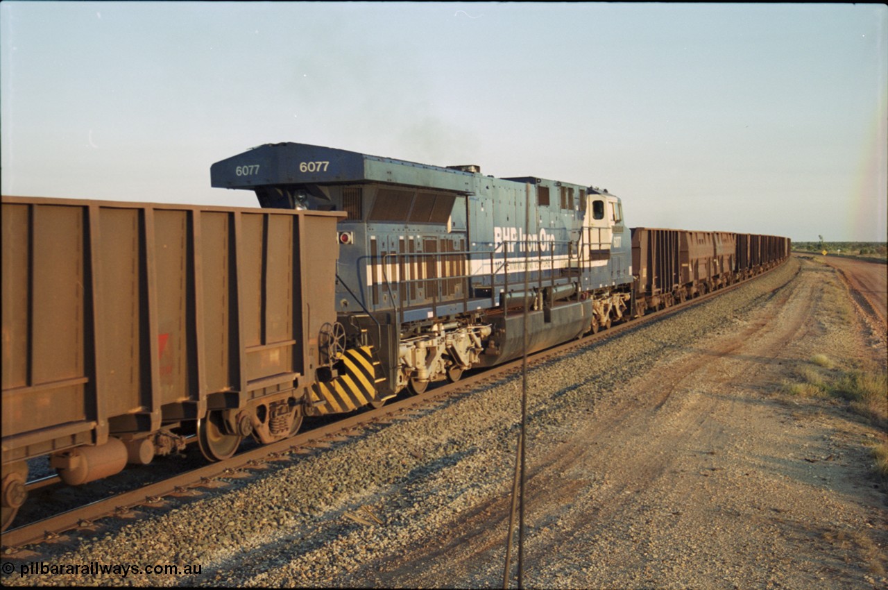 203-25
Bing Siding, min-train unit on an empty Yandi working BHP General Electric built AC6000 6077 'Nimingarra' serial 51069.
Keywords: 6077;GE;AC6000;51069;