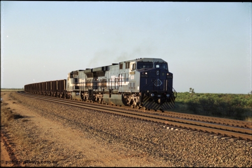 203-03
Bing Siding, an empty train behind a pair of BHP General Electric AC6000 units 6076 'Mt Goldsworthy' serial 51068 and class leader 6070 'Port Hedland' serial 51062 run around the passing track up to the departure signal.
Keywords: 6076;GE;AC6000CW;51068;