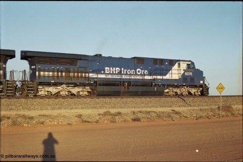 203-05
Bing Siding, BHP General Electric built AC6000 unit 6076 'Mt Goldsworthy' serial 51068 in the passing track with a Yandi empty working.
Keywords: 6076;GE;AC6000;51068;