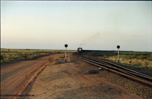 203-16
Bing Siding, with the empty clear, BHP General Electric AC6000 unit 6076 'Mt Goldsworthy' serial 51068 powers its' train out of the passing track at Bing South.
Keywords: 6076;GE;AC6000CW;51068;