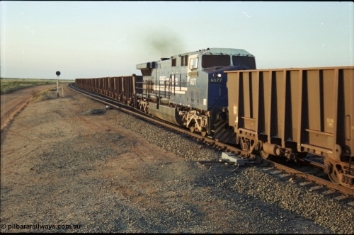 203-24
Bing Siding, min-train unit on an empty Yandi working BHP General Electric built AC6000 6077 'Nimingarra' serial 51069 with the second style of PVC type windscreen protectors fitted.
Keywords: 6077;GE;AC6000CW;51069;