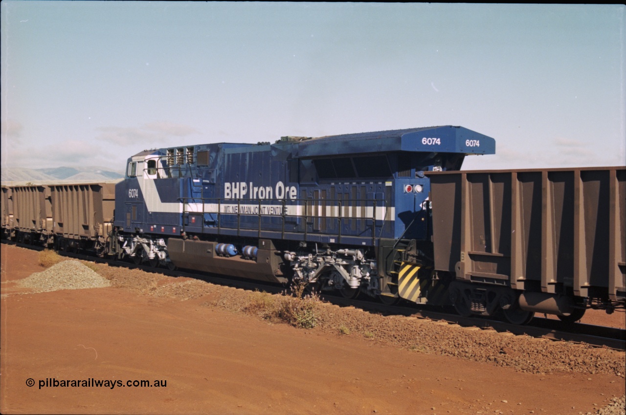 207-08
BHP General Electric built AC6000 unit 6074 serial 51066, brand new and unnamed at Yandi One load-out loop as a remote mid-train unit.
Keywords: 6074;GE;AC6000;51066;railpage:class=250;railpage:loco=6074;rp-au-bhp-ac6000;rp-au-bhp-ac6000-6074;