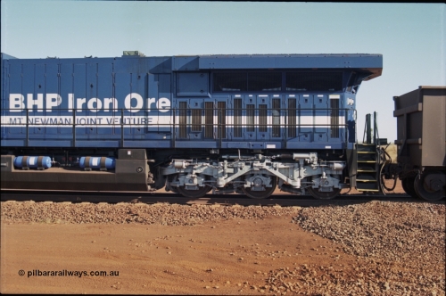 207-09
BHP General Electric built AC6000 unit 6074 serial 51066, brand new and unnamed at Yandi One load-out loop as a remote mid-train unit, the size of the extended radiator compared to domestic AC6000 units is evident here.
Keywords: 6074;GE;AC6000CW;51066;