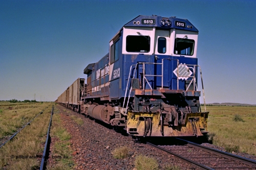207-21
Hardie Siding, BHP locomotive 5513 is the final member of Goninan rebuilds from ALCo C636 5453 into a GE C36-7M unit 5513 serial 4839-02 / 88-078, with 'Kalgan' nameboards removed for fitting to AC6000 class 6074, holds the main with a loaded Yarrie train awaiting a cross.
Keywords: 5513;Goninan;GE;C36-7M;4839-02/88-078;rebuild;AE-Goodwin;ALCo;C636;5453;G6012-2;