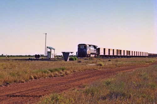 207-26
Hardie Siding, BHP unit 5669 'Builen' is the highest numbered CM40-8MEFI rebuild by Goninan, serial 8412-02 / 95-160, leading an empty train pauses to allow the 2nd person to alight and set the road for the passing track. 
Keywords: 5669;Goninan;GE;CM40-8EFI;8412-02/95-160;rebuild;Comeng-NSW;ALCo;M636C;5486;C6084-2;