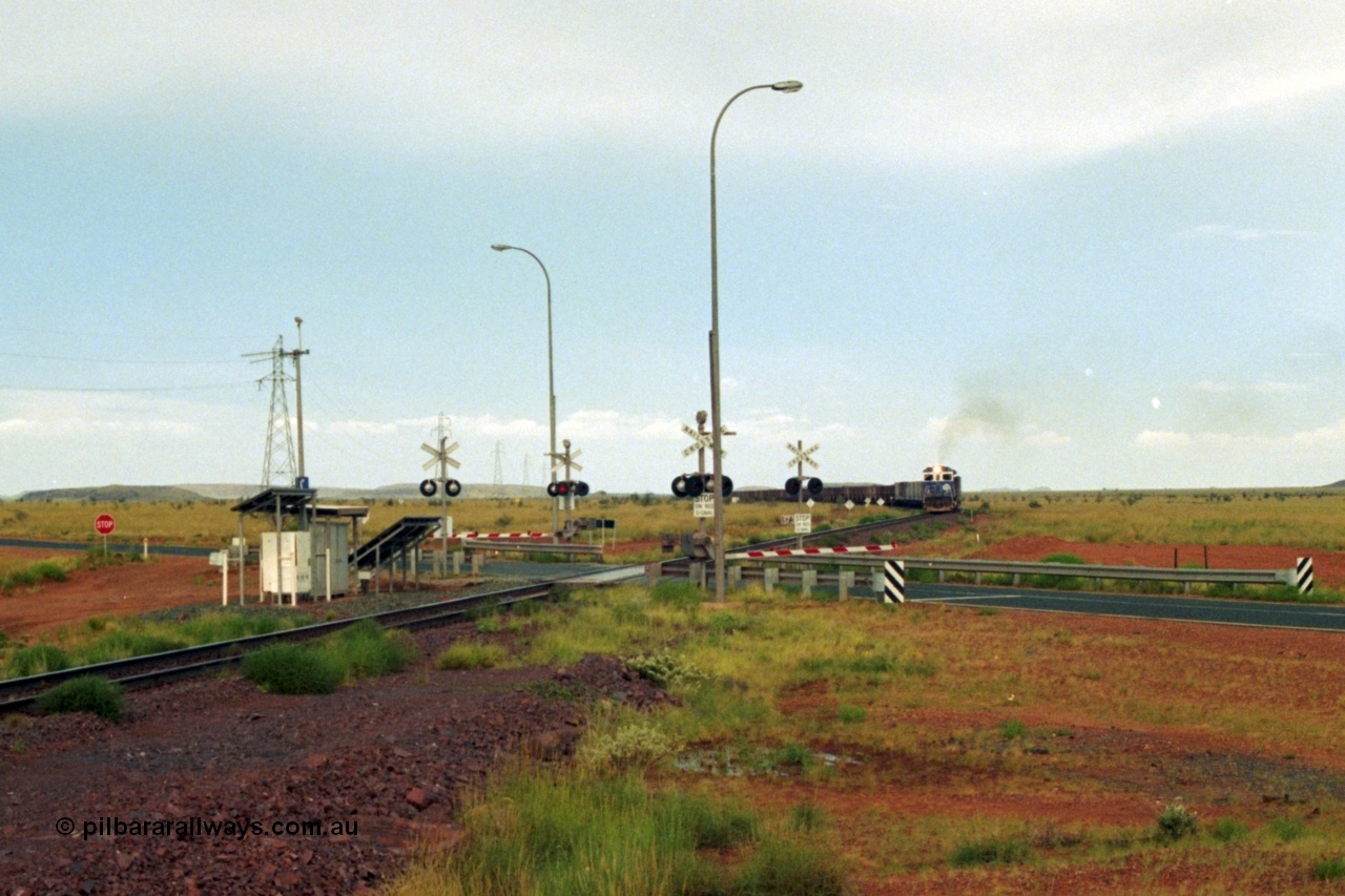 218-21
De Grey, Great Northern Highway grade crossing at the 57.15 km with a loaded train on approach.
Keywords: 5510;Goninan;GE;C36-7M;4839-07/87-075;rebuild;AE-Goodwin;ALCO;C636;5458;G6027-2;
