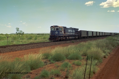 219-20
Goldsworthy Siding, C36-7M unit 5507 'Nimingarra' serial 4839-03 / 87-072, an original Mt Newman Mining ALCo C636 5461 to GE C36-7M rebuild carried out by Goninan, leads an empty train, the waggon behind 5507 is numbered 352 and is one of ten Portec USA built waggons originally from Phelps Dodge Copper Mine.
Keywords: 5507;Goninan;GE;C36-7M;4839-03/87-072;rebuild;AE-Goodwin;ALCo;C636;5461;G6035-2;