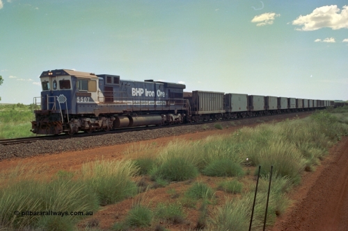 219-21
Goldsworthy Siding, C36-7M unit 5507 'Nimingarra' serial 4839-03 / 87-072, an original Mt Newman Mining ALCo C636 5461 to GE C36-7M rebuild carried out by Goninan, leads an empty train at Goldsworthy, the waggon behind 5507 is numbered 352 and is one of ten Portec USA built waggons originally from Phelps Dodge Copper Mine.
Keywords: 5507;Goninan;GE;C36-7M;4839-03/87-072;rebuild;AE-Goodwin;ALCo;C636;5461;G6035-2;