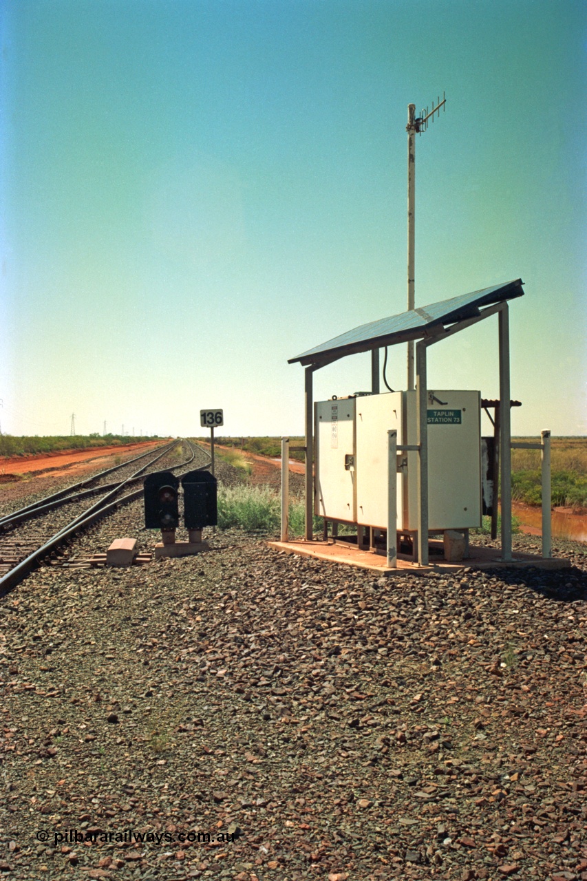 220-02
Taplin Siding, located between the 135 and 137.5 km on the former Goldsworthy Mining Ltd line, now part of the BHP Iron Ore network looking east past the point indicators and the 136 km post.
