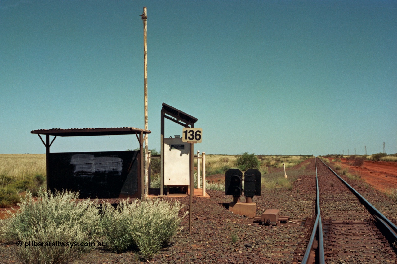 220-03
Taplin Siding, located between the 135 and 137.5 km on the former Goldsworthy Mining Ltd line, now part of the BHP Iron Ore network looking west at the points, indicator and shelter located at the 136 km or Hedland end.
