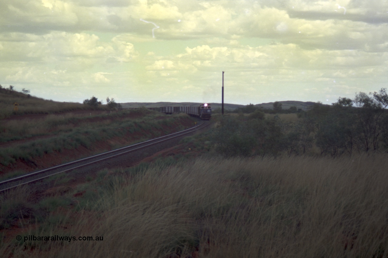 220-13
Just west of the 104.6 km crossing on the Yarrie line, BHP Iron Ore Goninan rebuilt ALCo C636 5431 into a C36-7M unit 5507 serial number 4839-03 / 87-072 seen here leading its loaded train through the curves.
Keywords: 5507;Goninan;GE;C36-7M;4839-03/87-072;rebuild;AE-Goodwin;ALCo;C636;5461;G6035-2;