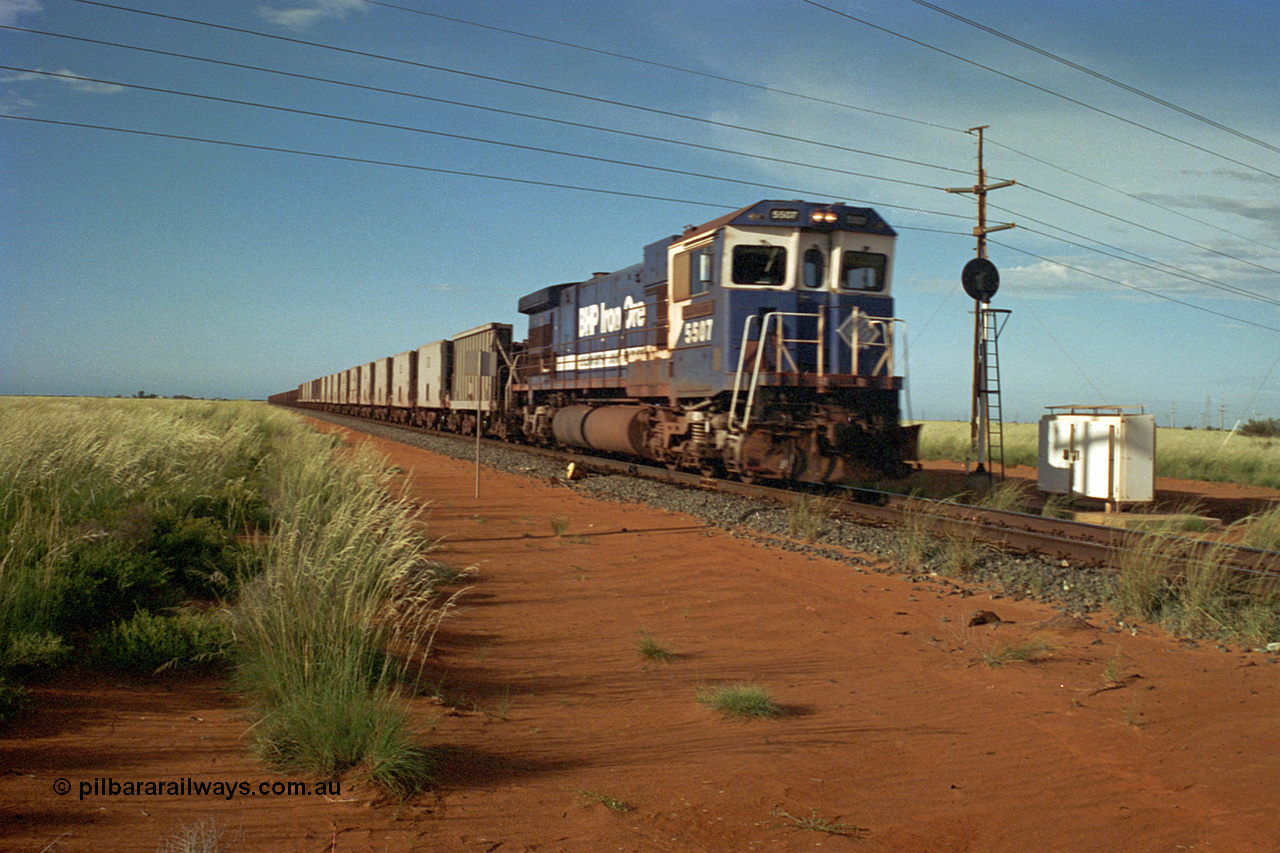 220-24
Goldsworthy Junction, a loaded train from Yarrie mine lead by BHP Dash 7 unit 5507 'Nimingarra' serial 4839-03 / 87-072 was rebuilt by Goninan WA from an ALCo C636 unit 5461 into GE model C36-7M in 1987.
Keywords: 5507;Goninan;GE;C36-7M;4839-03/87-072;rebuild;AE-Goodwin;ALCo;C636;5461;G6035-2;