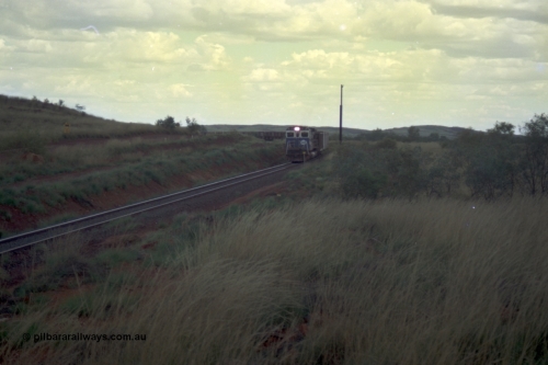 220-14
Just west of the 104.6 km crossing on the Yarrie line, BHP Iron Ore Goninan rebuilt ALCo C636 5431 into a C36-7M unit 5507 serial number 4839-03 / 87-072 seen here leading its loaded train through the curves.
Keywords: 5507;Goninan;GE;C36-7M;4839-03/87-072;rebuild;AE-Goodwin;ALCo;C636;5461;G6035-2;