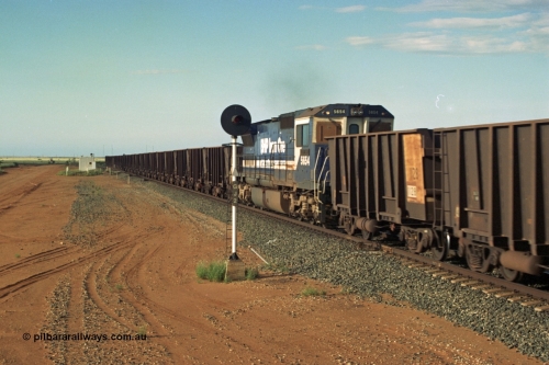 220-34
Goldsworthy Junction, empty train with mid-train loco a Goninan GE rebuild CM40-8M model 5654 'Kashima' serial 8412-11 / 93-145, seen here as the middle remote during a period of trials on Yandi trains where the consist was two leads units, 112 waggons, one loco, 112 waggons and the final loco.
Keywords: 5654;Goninan;GE;CM40-8M;8412-11/93-145;rebuild;Comeng-NSW;ALCo;M636C;5493;C6084-9;