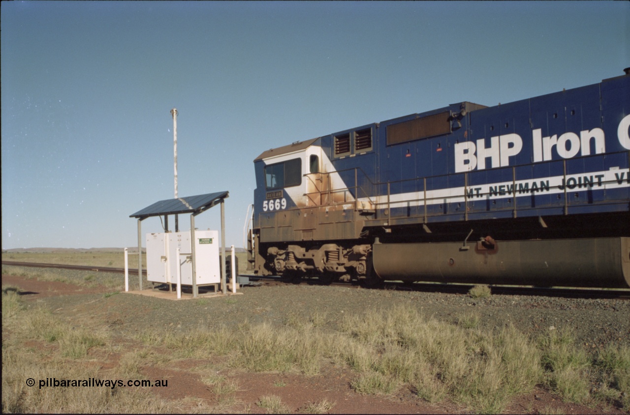 221-16
Hardie Siding, BHP Iron Ore Goninan rebuild unit CM40-8MEFI 5669 the last Dash 8 rebuilt for BHP and one of four fitted with an EFI prime mover, serial 95-160/8412-02, passes the Hardie Station 71 location cases and continues on the mainline bound for loading at Yarrie.
Keywords: 5669;Goninan;GE;CM40-8EFI;8412-02/95-160;rebuild;Comeng-NSW;ALCo;M636C;5486;C6084-2;