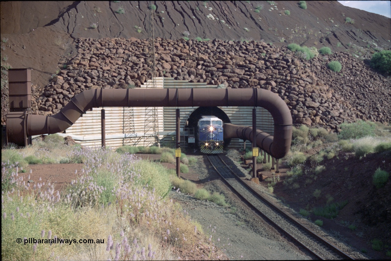 221-22
Yandi One mine loadout balloon loop, General Electric AC6000 class emerges from the loadout portal at 0.9 km/h as it leads a train through the loading vaults, the dust extraction ducting is also visible.
Keywords: GE;AC6000;51062-9;