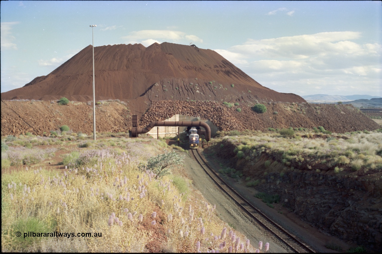 221-24
Yandi One mine loadout balloon loop, overview of the stockpile, the train can be seen in the middle distance on the right.
Keywords: GE;AC6000;51062-9;