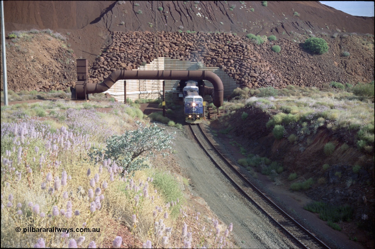 221-25
Yandi One mine loadout balloon loop, General Electric AC6000 class emerges from the loadout portal at 0.9 km/h as it leads a train through the loading vaults, the dust extraction ducting is also visible.
Keywords: GE;AC6000;51062-9;