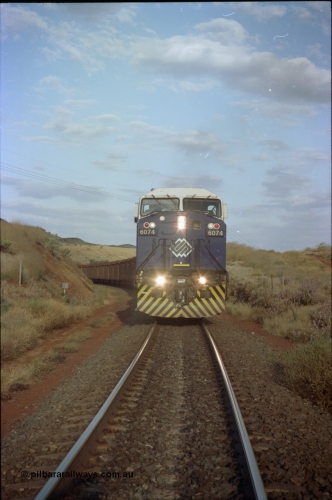 221-37
Yandi One mine loadout balloon loop, front on view of near new General Electric AC6000 unit 6074 serial 51066 as it loads a train.
Keywords: 6074;GE;AC6000CW;51066;