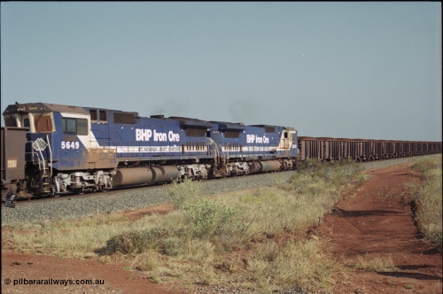 222-05
At the 105.7 km grade crossing near Gillam Siding, a loaded Yandi train's remote units 5649 'Pohang' serial 8412-07 / 93-140 and sister unit 5639 both Goninan rebuild CM40-8M GE units. This road was also the original road into Lynas Find Gold Project, back in the day. [url=https://goo.gl/maps/7emwhQdnBN32]GeoData[/url].
Keywords: 5649;Goninan;GE;CM40-8M;8412-07/93-140;rebuild;AE-Goodwin;ALCo;M636C;5473;G6047-5;