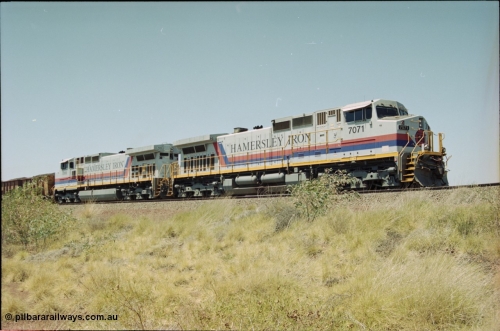222-17
Somewhere on the original single line section between Gull and Rosella Hamersley Iron 7071 serial 47750 a General Electric Dash 9-44CW built by GE at Erie brings a loaded train to a stand with 7066 for a crew change.
Keywords: 7071;GE;Dash-9-44CW;47750;